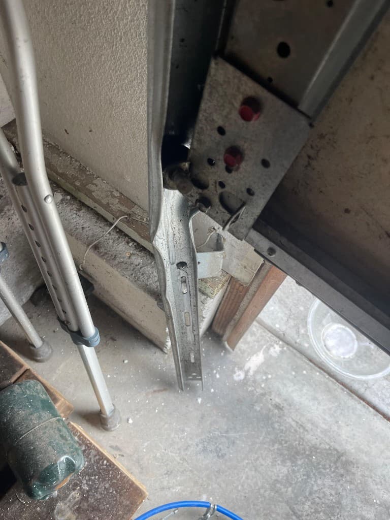 Bent garage door track and roller requiring realignment in Portland and Salem Metro — Off-Track Repair